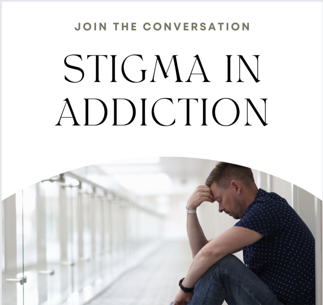 A man sits against a wall. He is somber and alone. He fears the stigma he will face for his substance use disorder. 